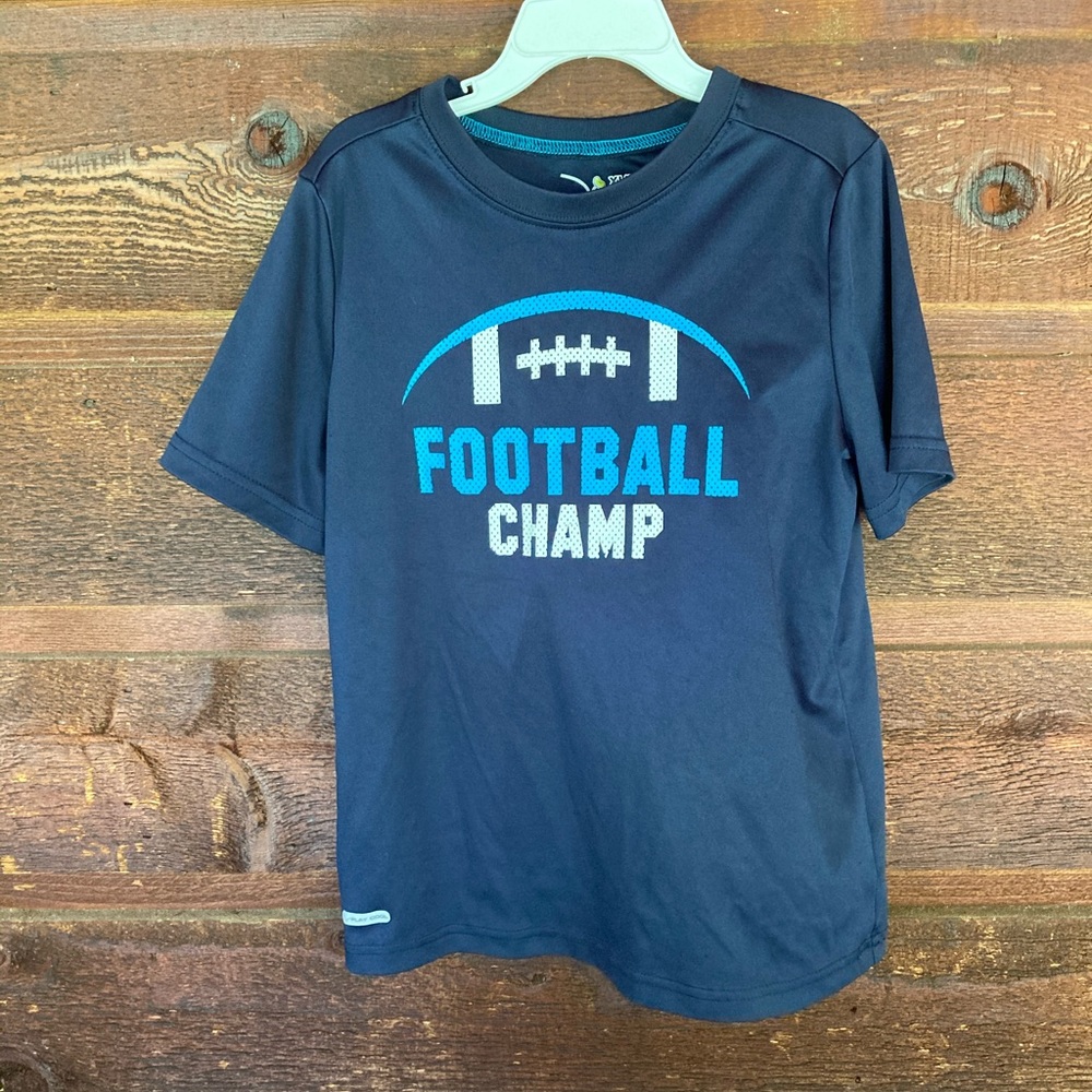 Navy dry fit “football champ” short sleeve tee.